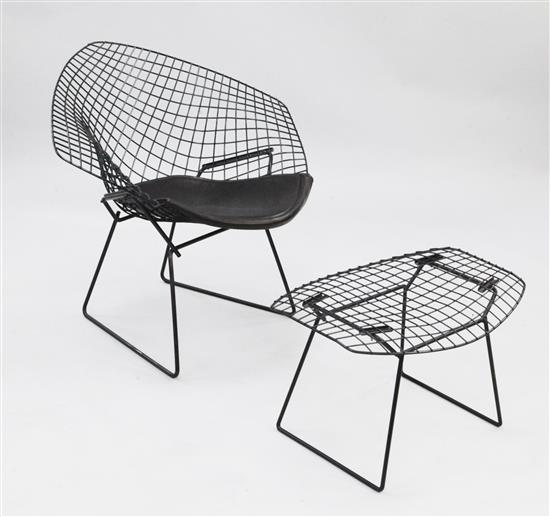 A black wire work diamond chair and foot stool, designed by Harry Bertoia,